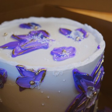 purple floral birthday cake with gold miami